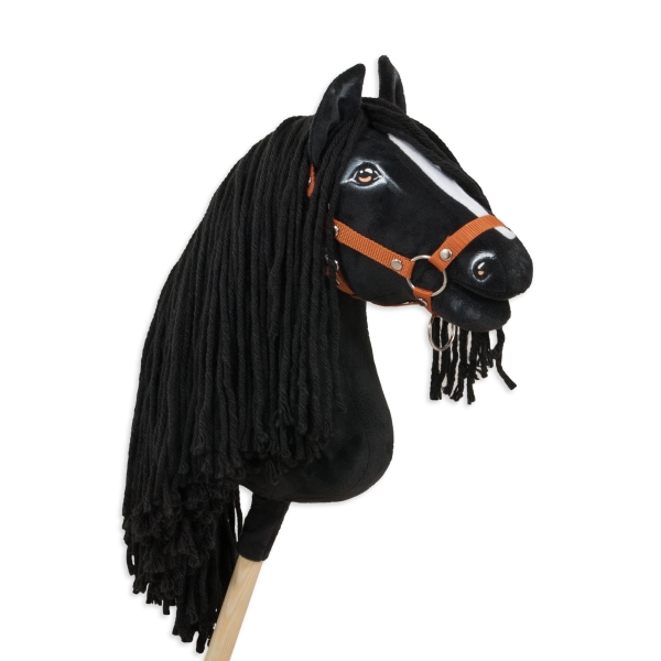 Schwarzes Hobby Horse mit weißer Blesse und langer Mähne